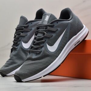 Nike Downshifter 9 running shoes in a cool grey color